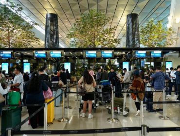 Suasana penumpang Garuda Indonesia di Bandara Soetta