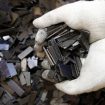 Rare earth magnets, recovered from the magnetic rotors of discarded compressors, are displayed for a photograph at Hitachi Plant Technologies Ltd.'s Matsudo research laboratory in Matsudo City, Chiba Prefecture, Japan, on Monday, Dec. 6, 2010. Hitachi Ltd. said it developed machinery to harvest rare earth metals from discarded hard-disk drives and compressors as electronics makers seek to reduce their reliance on Chinese supply. Photographer: Kiyoshi Ota/Bloomberg