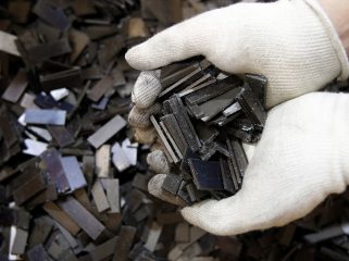 Rare earth magnets, recovered from the magnetic rotors of discarded compressors, are displayed for a photograph at Hitachi Plant Technologies Ltd.'s Matsudo research laboratory in Matsudo City, Chiba Prefecture, Japan, on Monday, Dec. 6, 2010. Hitachi Ltd. said it developed machinery to harvest rare earth metals from discarded hard-disk drives and compressors as electronics makers seek to reduce their reliance on Chinese supply. Photographer: Kiyoshi Ota/Bloomberg