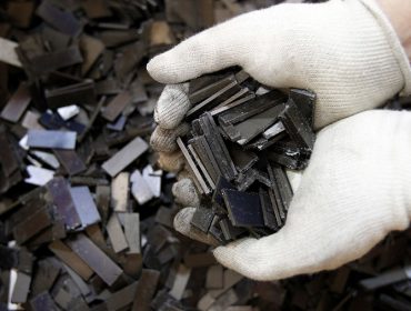 Rare earth magnets, recovered from the magnetic rotors of discarded compressors, are displayed for a photograph at Hitachi Plant Technologies Ltd.'s Matsudo research laboratory in Matsudo City, Chiba Prefecture, Japan, on Monday, Dec. 6, 2010. Hitachi Ltd. said it developed machinery to harvest rare earth metals from discarded hard-disk drives and compressors as electronics makers seek to reduce their reliance on Chinese supply. Photographer: Kiyoshi Ota/Bloomberg