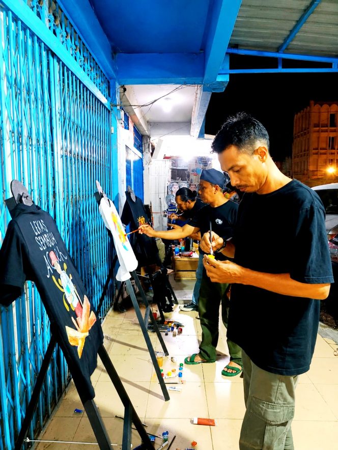 
 Semarak Show Art Melukis di Atas Kaos Meriahkan Peunayong, Sempat Padatkan Jalan Khairil Anwar